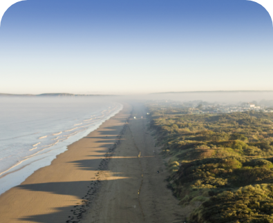 Aerial view of sandy beach and coastline near Unity Beach holiday park