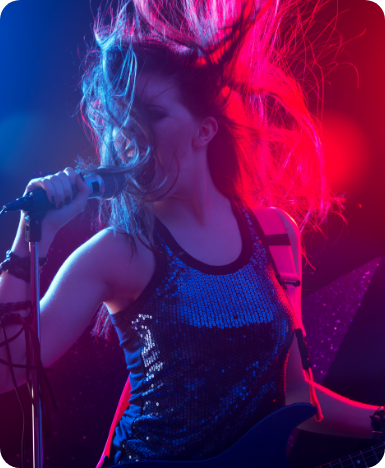 Singer performing live under stage lights