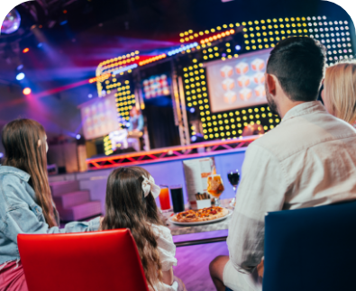 Family enjoying refurbished on-site bars and entertainment venues at Unity Beach